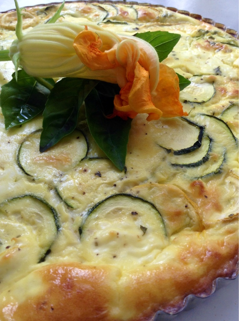 This is a delightfully light and savory tart. Filled with garden squash, creamy French goat cheese and artichokes. Perfect for a late summer picnic! ~Amy